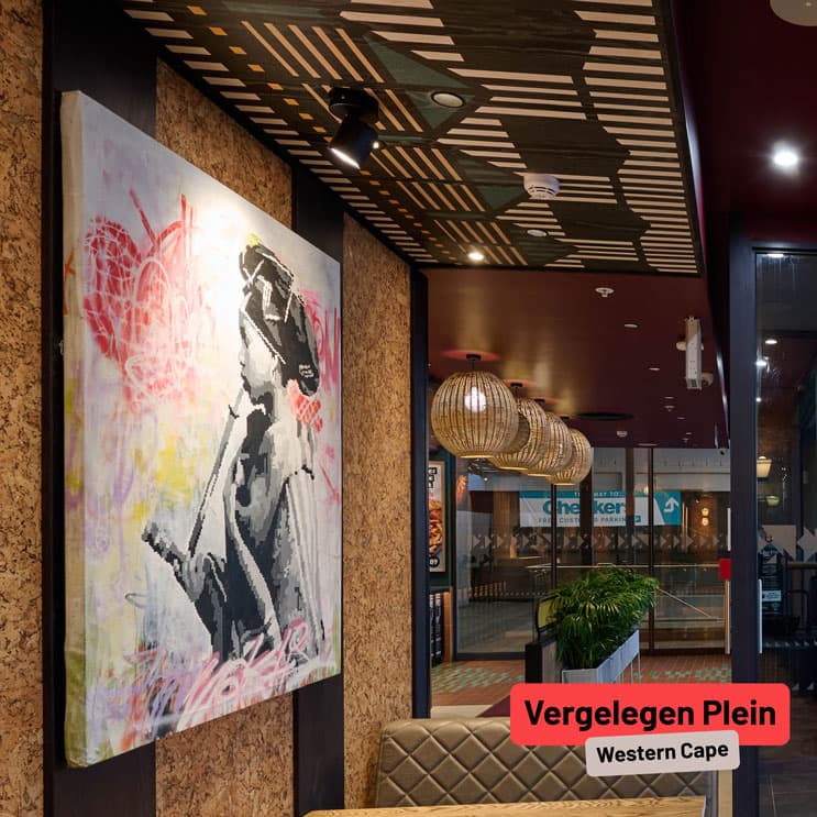Artwork of lady smoking a pipe at Nando's Vergelegen Plein