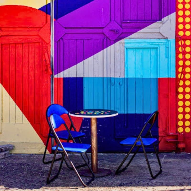 A background with table and chair full of colours