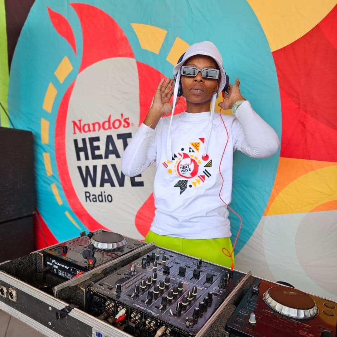 A woman next to a turntable