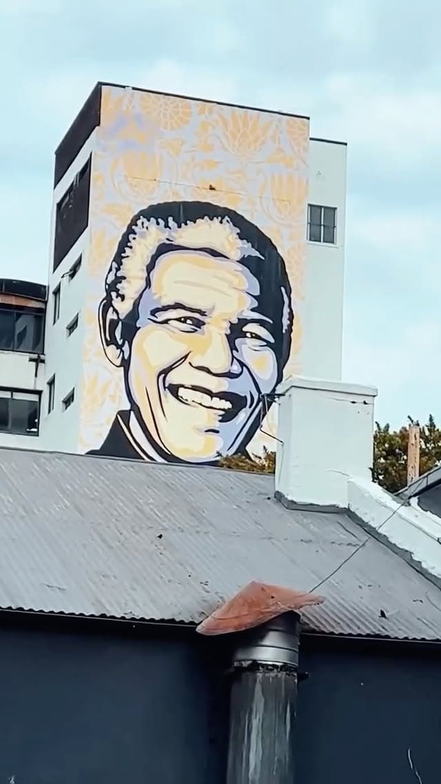 Mandela's face on the side of a building