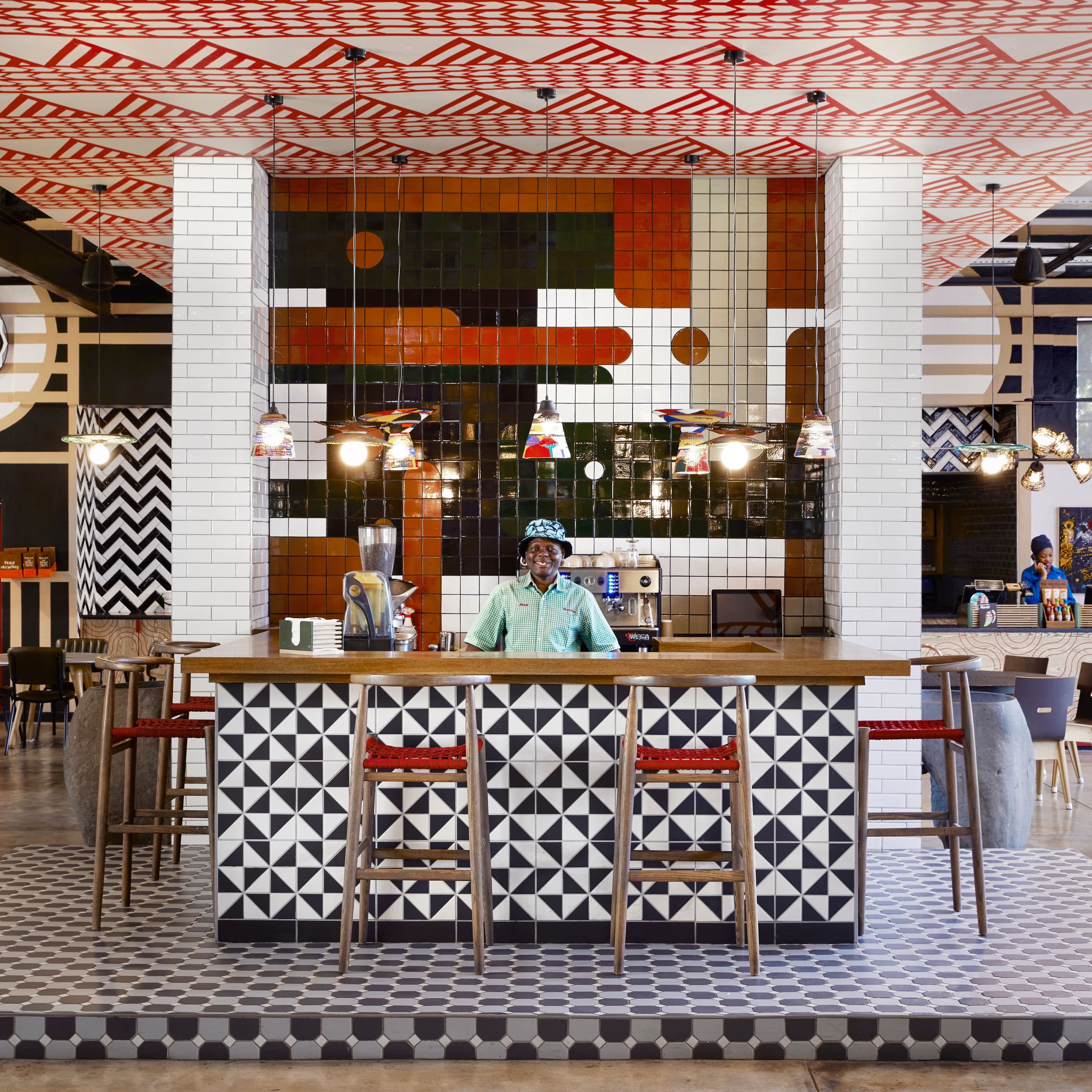 A person standing behind a counter at CK