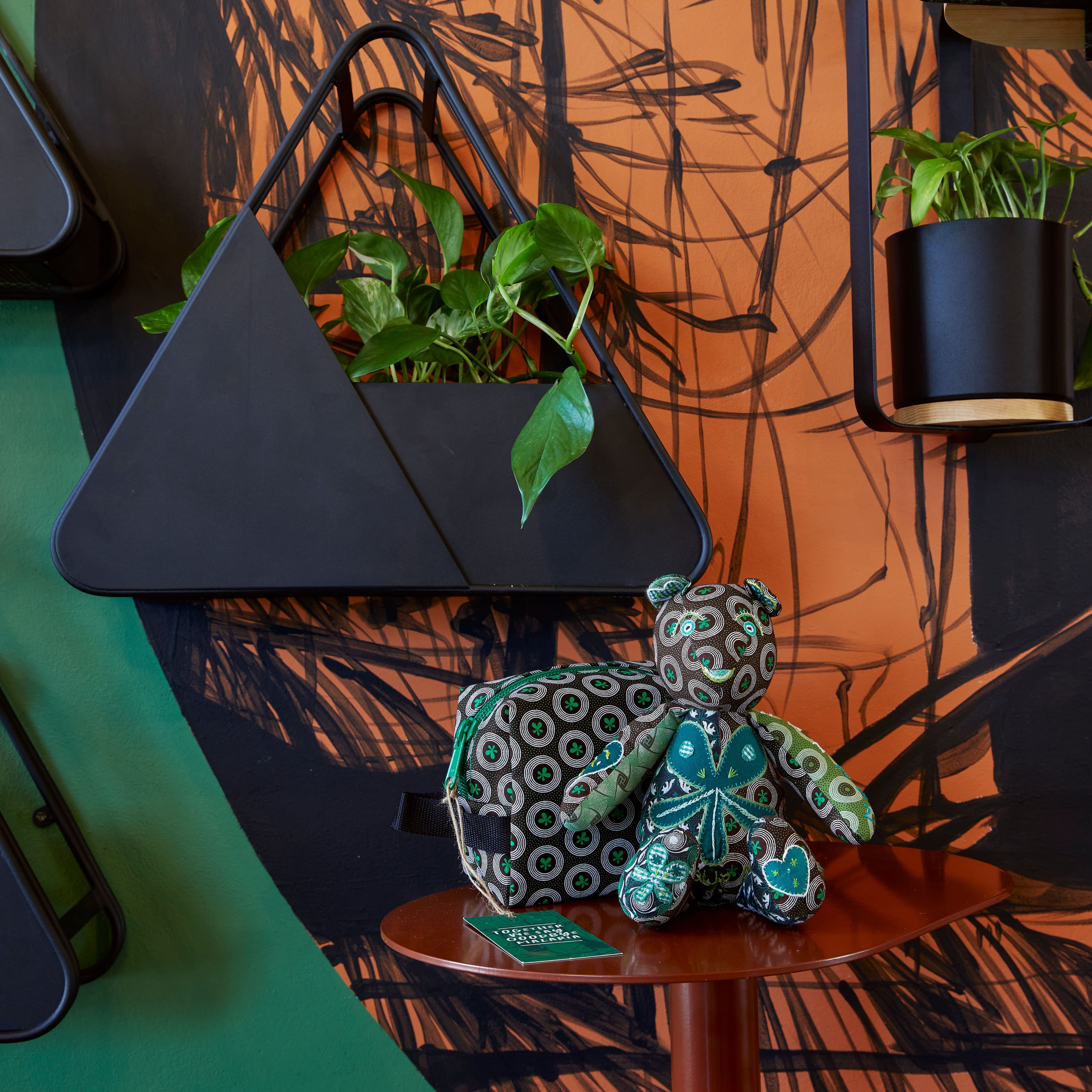 A teddy bear with various design on it