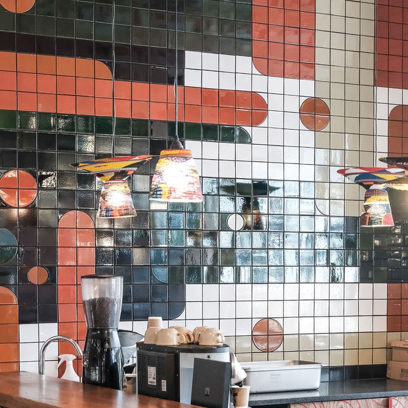 A tiled wall with design