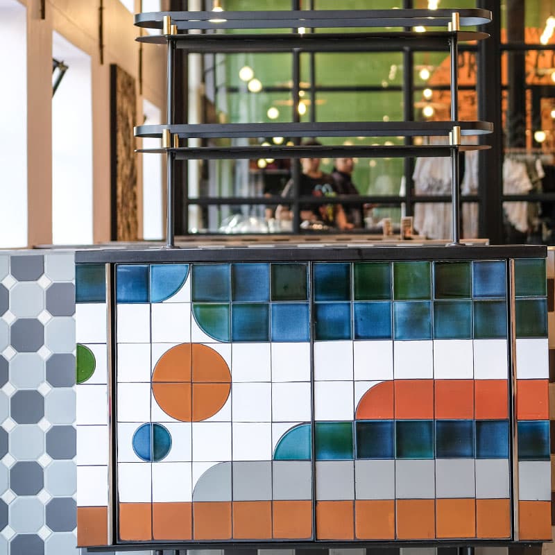 A tiled design on the side of a counter