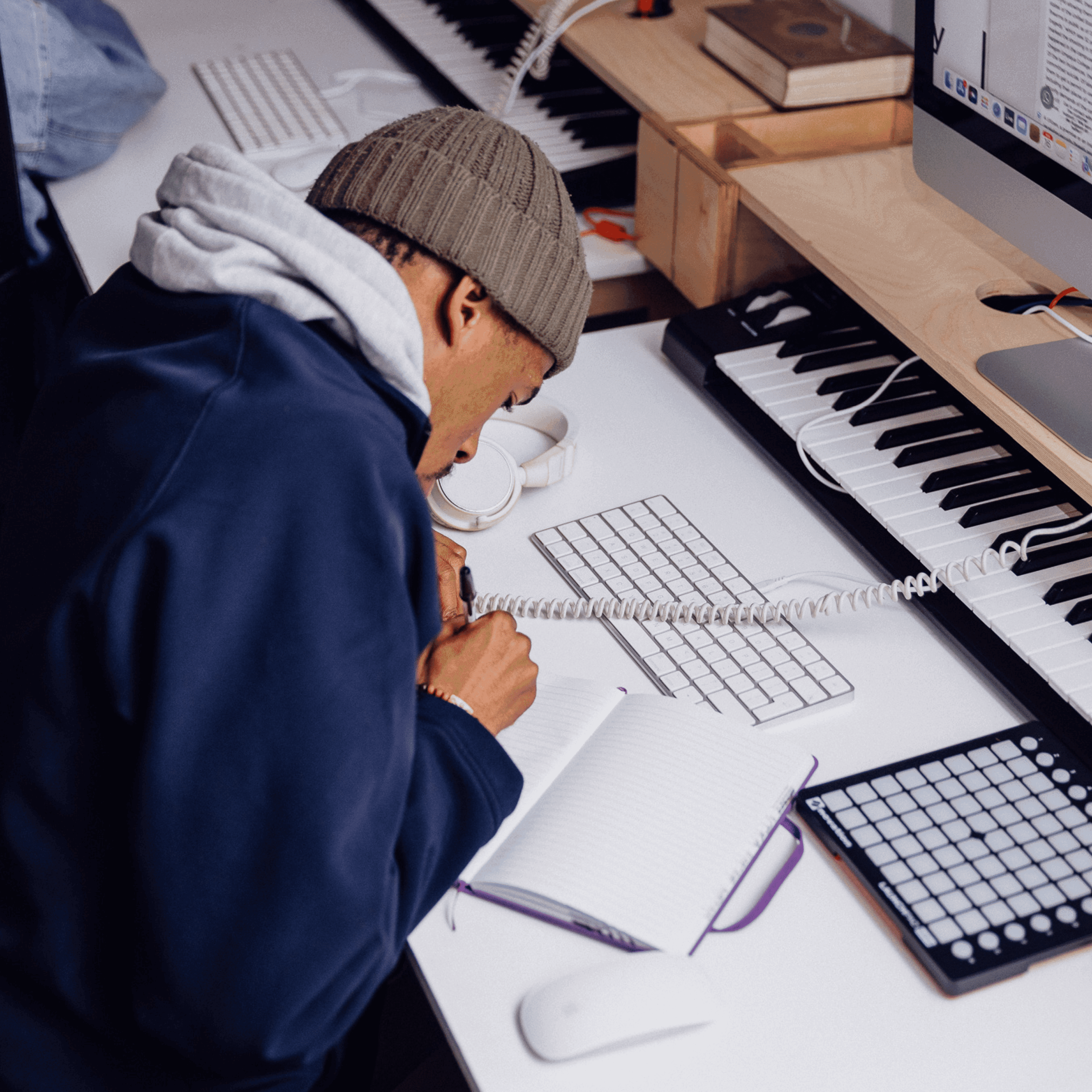 A person writing on a notebook